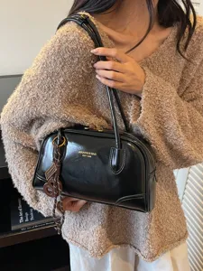 Stylish black patent leather shoulder bag for women, trendy vintage underarm pillow bag.