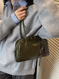 Green patent leather underarm shoulder bag for women, retro commuter pillow handbag.