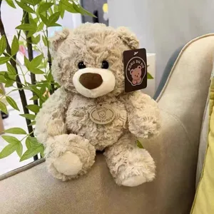 Cute plush teddy bear detail shot, soft furry fabric and warm sitting posture design.
