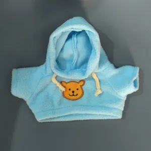 Blue plush doll hoodie sweater with cute bear face patch and adjustable drawstrings for toys.