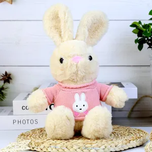 Cute plush rabbit toy with a pink knitted sweater, soft stuffed doll gift for kids and girls.