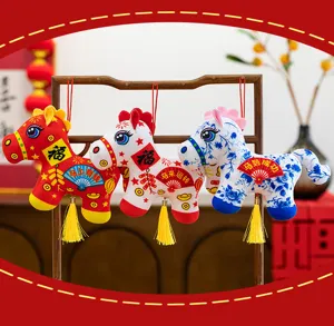 Chinese New Year plush horse hanging pendant detail showing festive lucky embroidered text and tassels