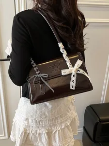 Stylish women's underarm shoulder bag with lace bow design, versatile daily fashion purse.