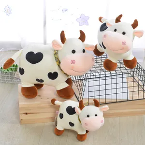 Cute dairy cow plush toy with heart spots, soft stuffed animal doll for kids and gifts.