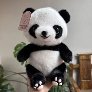 Detailed view of the cute panda plush toy showing soft black and white fur and delicate paw details.
