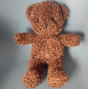 Brown fuzzy teddy bear plush toy detail shot, soft plush material and cute classic stuffed animal.