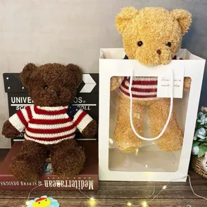 Lindo peluche de osito de peluche con jersey a rayas en caja de regalo transparente con luz.