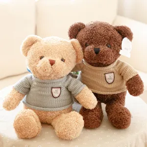 Cute plush teddy bear toy with knitted sweater, soft stuffed animal doll for gifts and parties.