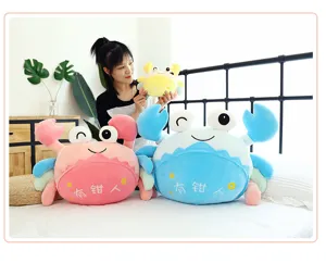 Close-up detail of cute crab plush toys in a cozy bedroom setup, soft fabric and embroidery.