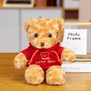 Cute plush teddy bear wearing a red hoodie with sweet embroidery, soft hugging doll gift.