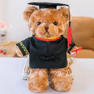 Graduation teddy bear plush toy detail shot, wearing bachelor gown and cap with cute face.