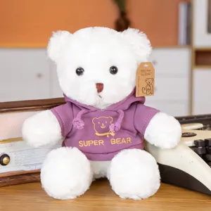 Cute white plush teddy bear wearing purple hoodie with cute bear embroidery, soft stuffed toy.