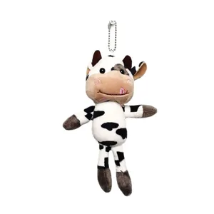 Cute cow plush toy keychain, soft stuffed animal bag charm and pendant for girls and kids.