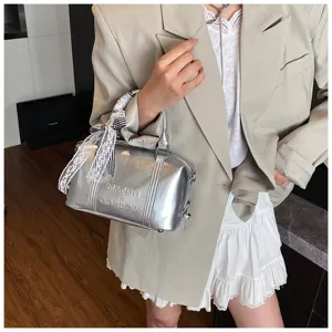 Metallic silver bowling handbag for women with stylish ribbon handle decor chic crossbody bag.