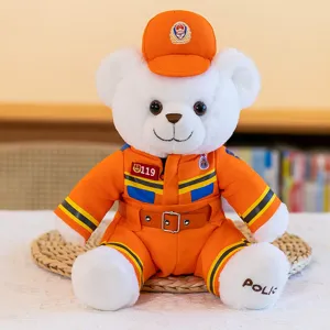 Plush teddy bear toy wearing orange rescue uniform and hat, cute and soft gift for kids.