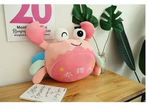Cute pink crab plush toy detailed view, soft stuffed animal with funny claw embroidery text.