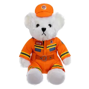 White teddy bear plush toy dressed in orange firefighter uniform with matching hat for gift.