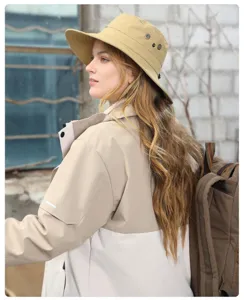 Detailed view of the khaki outdoor sun hat featuring wide brim and breathable metal eyelets.