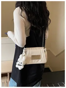 Stylish women's chain shoulder bag with cute rabbit pendant for daily commuting and chic style.