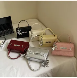 Classic style women handbag tote crossbody bag with cute rabbit charm and metal lock.