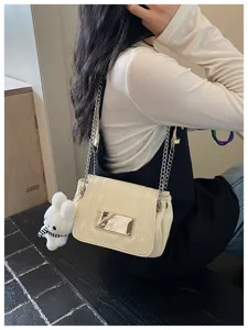 Chic patent leather shoulder bag with chain strap and cute plush pendant for women.