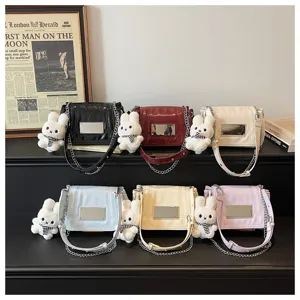 Stylish women shoulder bag with chain strap and cute rabbit pendant. Premium glossy square bag.