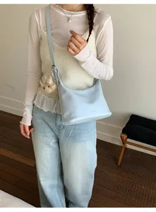 Stylish light blue shoulder crossbody dumpling bag for women, casual trendy handbag.