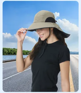 Detailed view of outdoor sun protection hat with wide brim, shawl and windproof rope.
