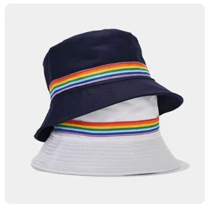 Details of the cotton bucket hat featuring a vibrant rainbow ribbon stripe and neat stitching.