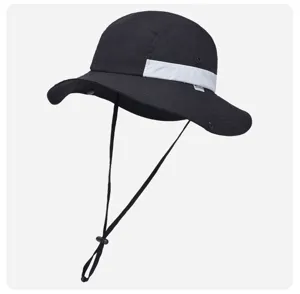 Close-up detail of the black outdoor sun hat featuring laser perforated mesh and adjustable chin strap.
