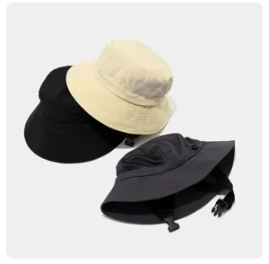 Detailed view of outdoor breathable bucket hat with mesh and windproof strap for surfing.