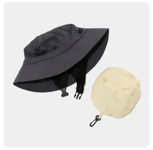 Detailed view of breathable foldable outdoor bucket hat with windproof strap and storage pouch.