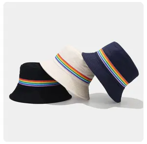 Detail view of cotton bucket hats featuring vibrant rainbow stripe webbing, casual unisex design.