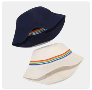 Detailed shot of double-sided bucket hats featuring colorful rainbow ribbon straps, casual style.