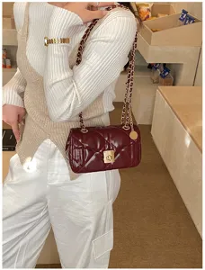 Chic quilted chain shoulder bag for women, stylish burgundy crossbody bag for daily fashion wear.