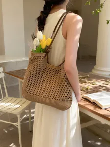 Woven straw tote bag for women, large capacity casual vacation shoulder bag with chic handle.