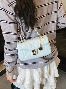 Light blue quilted chain shoulder bag for women, stylish crossbody handbag main view.