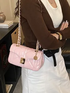 Pink quilted shoulder bag with gold chain strap, stylish chic crossbody handbag for women.
