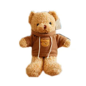 Cute brown teddy bear plush toy wearing a soft fleece hoodie with a small bear embroidery.