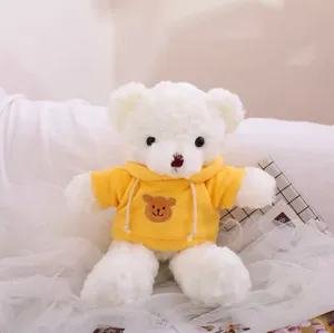 Cute plush teddy bear toy wearing a yellow hoodie, soft stuffed doll for kids and gifts.