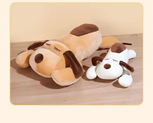 Close-up view of cute sleeping dog plush toys, soft long pillows in brown and white.