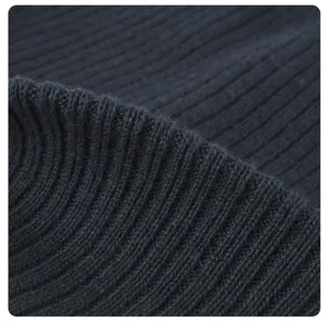 Close-up detail of soft ribbed knit fabric texture, showing fine craftsmanship and cozy warmth.