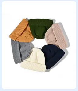 Detailed view of thick winter knitted beanie hats in multiple vibrant solid color choices.