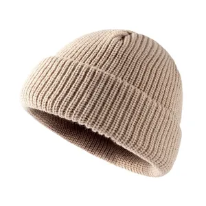 Classic beige ribbed knit beanie for cold winter days, warm cuff style woolen hat.
