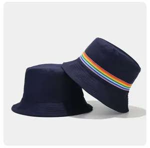 Detail view of stylish navy blue bucket hat featuring a vibrant rainbow ribbon trim for daily wear.