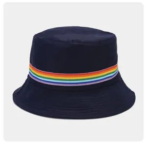 Rainbow ribbon detail on navy cotton bucket hat, soft fabric and stylish striped accent.