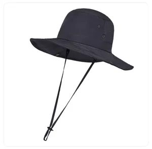 Close-up detail of the black wide brim sun hat, showing quick-drying fabric and chin strap.