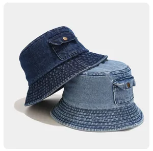 Washed retro denim bucket hat detail view, showcasing unique pocket design and casual style.