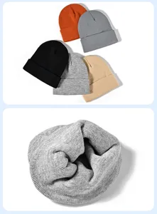 Detailed view of winter warm knitted beanies in multiple solid colors, soft textured knit fabric.