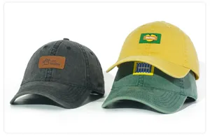 Detailed display of washed cotton baseball caps in dark gray, yellow and green with custom patches.